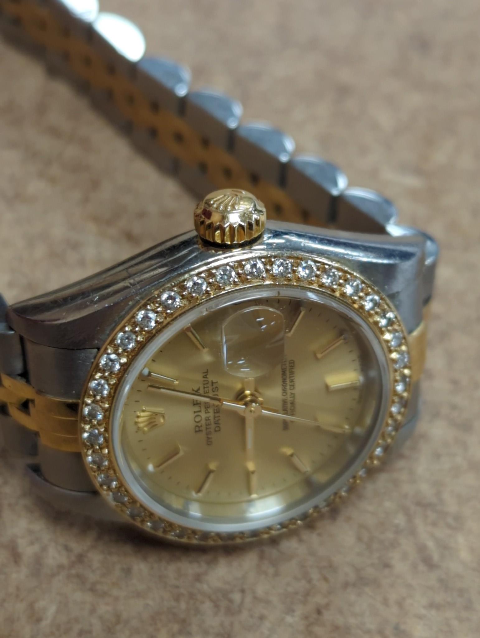 A lady's 2002 stainless steel and gold Rolex Oyster Perpetual Datejust wrist watch, with diamond set bezel, case diameter 26mm